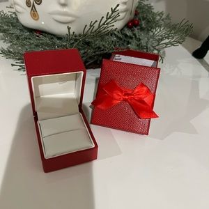Red jewelry box with bow